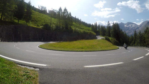 Motorcycle on Country Road To Grossglockner at the European Alps alt