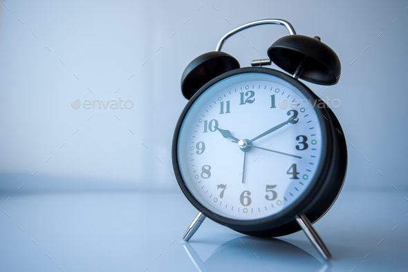 Retro style analog black alarm clock