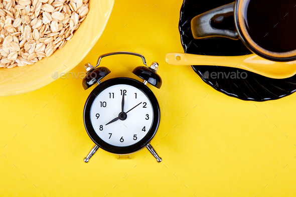Morning coffee, granola breakfast, alarm clock - Stock Photo - Images