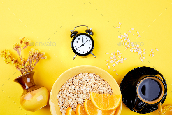 Morning coffee, granola breakfast, alarm clock - Stock Photo - Images