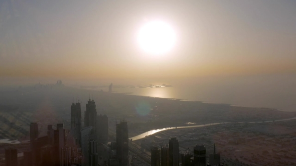 Sunset in Dubai View From Burj Khalifa Tower on Modern Districts and Gulf