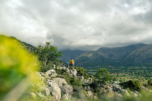 Hiking man looking at beautiful mountains Stock Photo by blas | PhotoDune