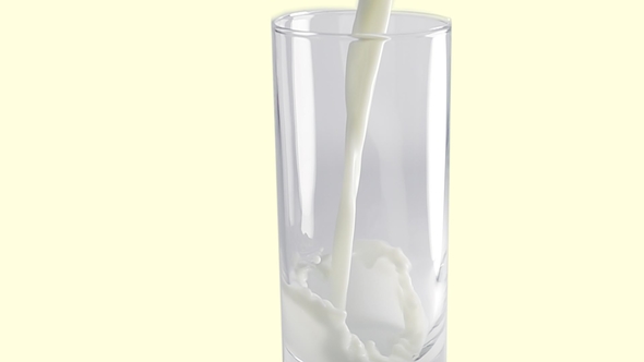 Milk Pouring Into Glass in