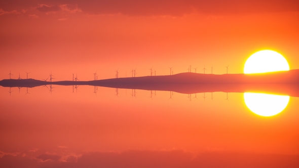 Clean Energy with Wind Turbines at Sunset,  Reflection