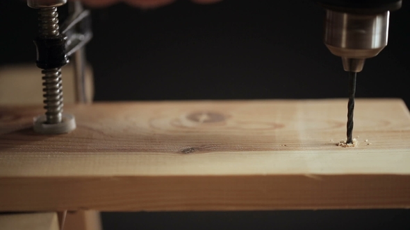Drilling a Hole in Wood Plank
