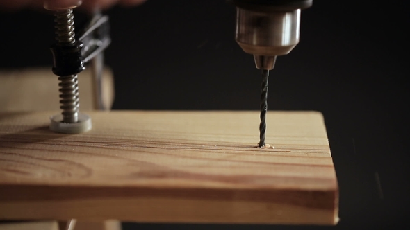 Drilling a Hole in Wood Plank