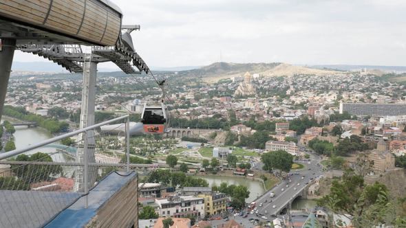 Cableway and View to the Holy Trinity Cathedral of Tbilisi in Georgia alt