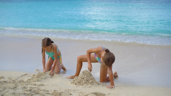 Adorable Little Girls During Summer Vacation on the Beach alt