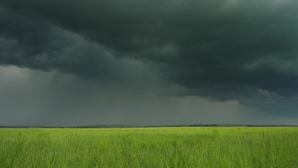 Dark Storm Clouds over Countryside Field alt