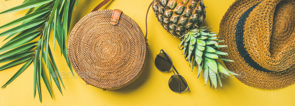 Colorful summer female outfit over yellow background, wide composition - Stock Photo - Images