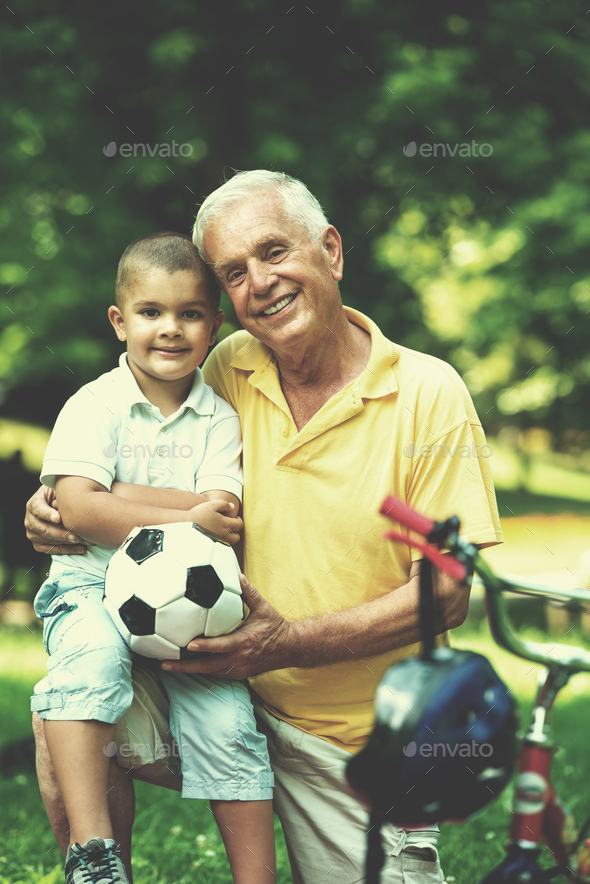 grandfather and child have fun in park Stock Photo by dotshock | PhotoDune