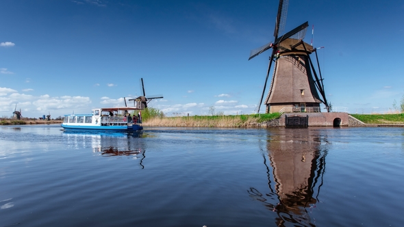 Ancient Windmills on Riverbank. Beauty of Holland. World Most Picturesque Places