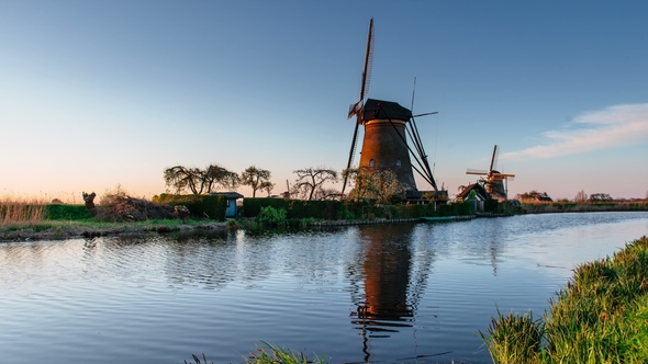 Ancient Windmills on Riverbank. Beauty of Holland. World Most Picturesque Places. Old Engineering