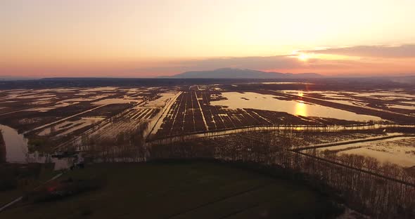 Aerial, Beautiful Fall Landscape On A Big Pond  On Sunset With Low Water And Sun Reflections 