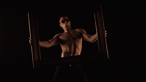 Sexy Man in the Frame of the Picture