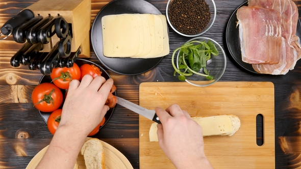 Making a Delicious Healthy Sandwich at the Kitchen on Wooden Board alt