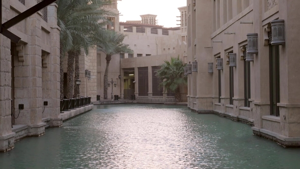 Traditional Arabian Buildings Are Based in Water, View of Walls and Palms, Picturesque