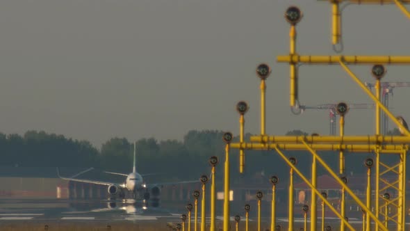 Passenger Airplanes take off on Schiphol runway 36L (Polderbaan) at Schiphol Airport
