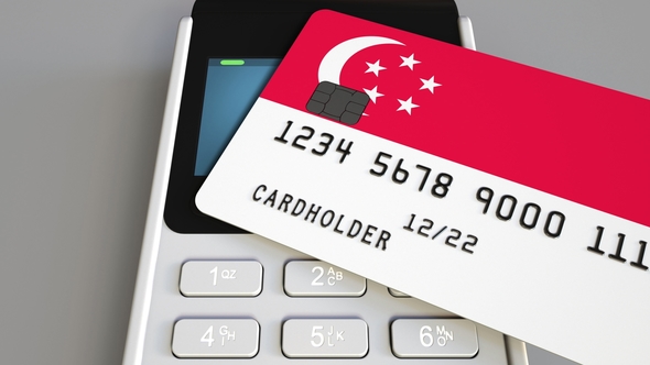 Payment Or Pos Terminal With Credit Card Featuring Flag Of Singapore By Moovstock