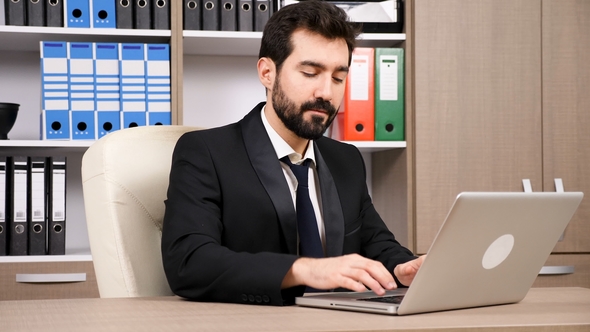 Happy Businessman Typing a Reply Then Looks at the Camera and Smiles ...