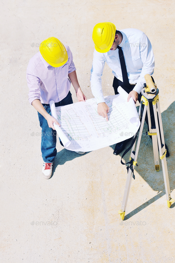 Team of architects on construciton site - Stock Photo - Images