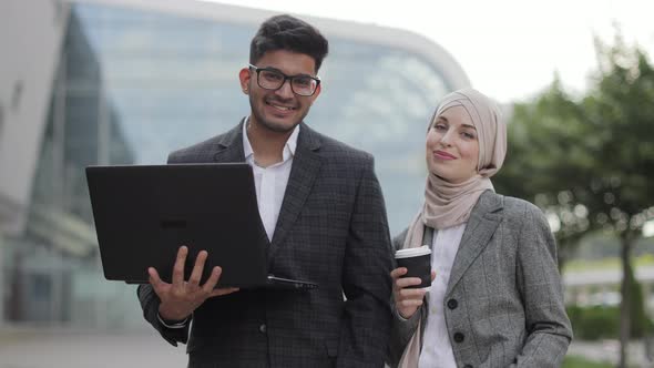 Business People with Laptop and Coffee Outdoors alt