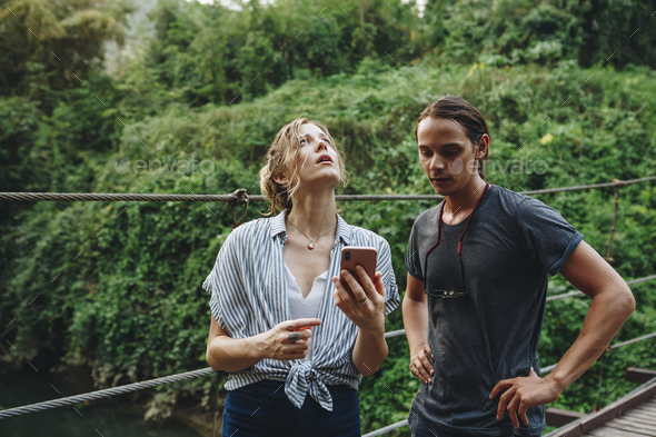 Caucasian woman and man having a bad cellular signal in the nature travel problem concept Stock Photo by Rawpixel