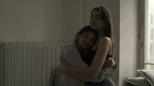 Women Hug Each Other