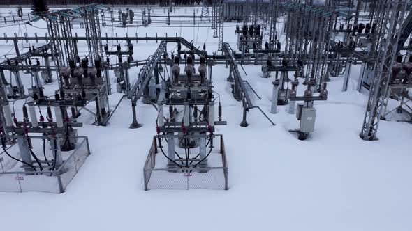 Aerial view of a high voltage electrical substation in winter season.