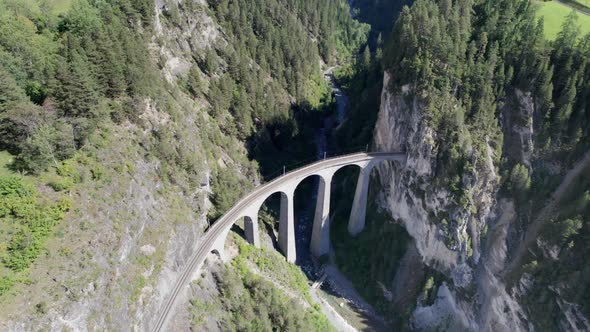 Landwasser Viaduct in Swiss Alps in Summer Aerial View on Green Mountain Valley alt