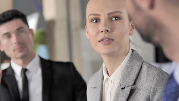 Close Up of Business Woman Talking at Meeting alt