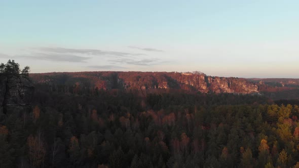 AERIAL: Famous Sandstone Rock appears out of forest in Saxon Siwtzerland alt