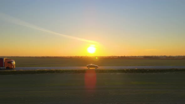 Aerial View of Cargo Truck Driving on Highway Hauling Goods alt