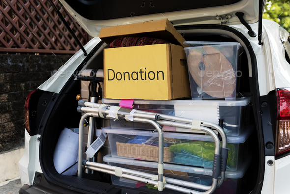 Donations in the back of a car - Stock Photo - Images