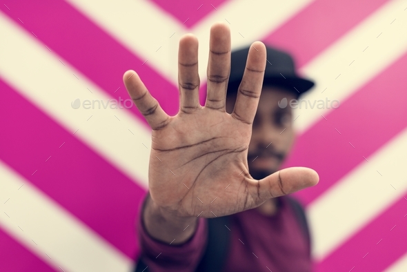 African man doing a "Talk to the hand!" pose Stock Photo by Rawpixel