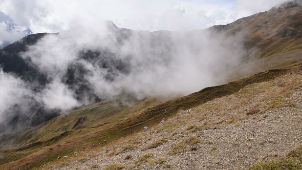 Rapid Floating Clouds Over Grassy Autumn Mountain Hill . Amazing Touristic Place. Upper Svaneti