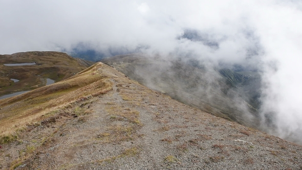 Clouds Fly Over the Ridge of the Caucasus Near Koruldi Lakes. Upper Svaneti, Mestia Near Ushba Pass