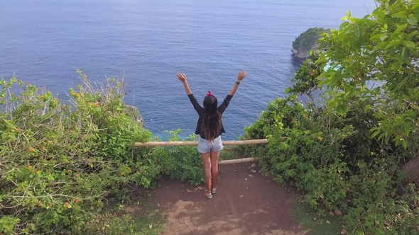 Young Mixed Race Tourist Girl Standing on the Edge of the Cliff with ...