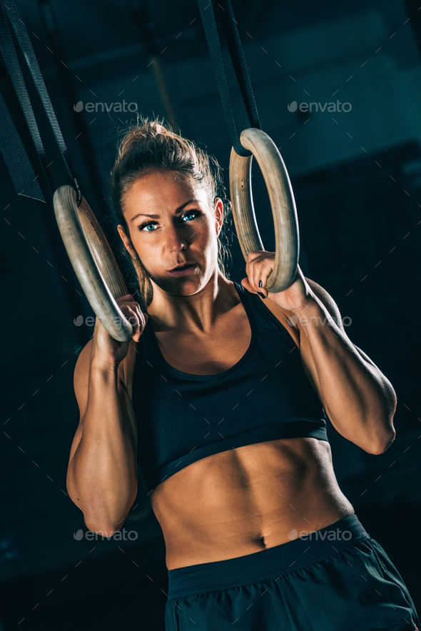 Cross training. Gymnastic rings exercising Stock Photo by microgen