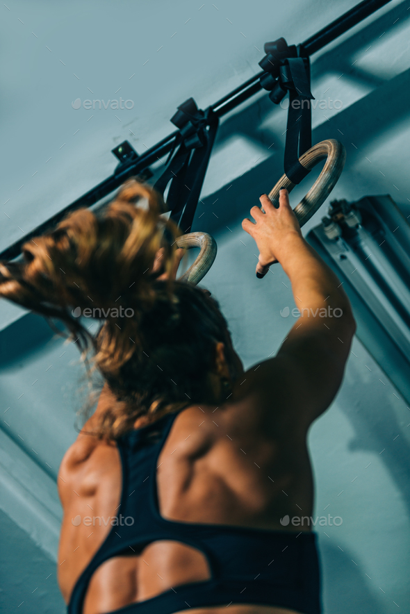 Cross training. Gymnastic rings exercising Stock Photo by microgen