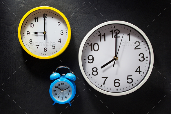 wall and alarm clock at black background Stock Photo by seregam | PhotoDune