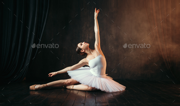 Grace of ballerina in motion on theatrical stage Stock Photo by NomadSoul1