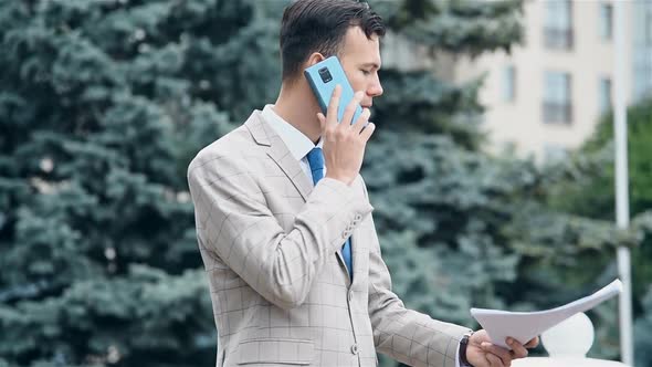 Trader Man Talking On Smart Phone alt