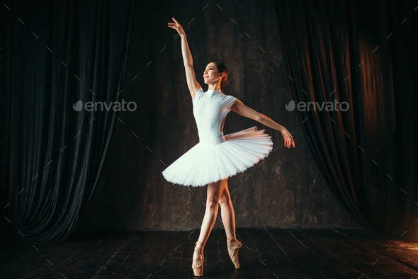 Graceful ballerina dancing in ballet class Stock Photo by NomadSoul1