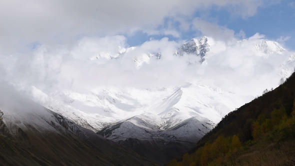 of Thick Clouds Floating Over Amazing Touristic Place Mountain Shkhara, Svaneti Region, Along the