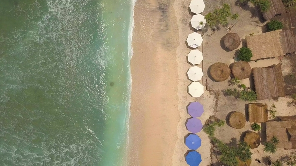 Sandy Beach with Umbrellas and Lounge Beds at Paradise Tropical Island. Nusa Penida