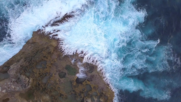 Angels Billabong Natural Pool. Big Blue Sea Waves Crashing on Rock Cliff at Tropical Island