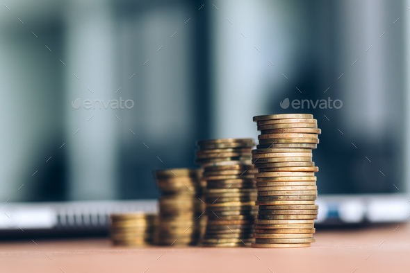 Coin stack on office desk - Stock Photo - Images