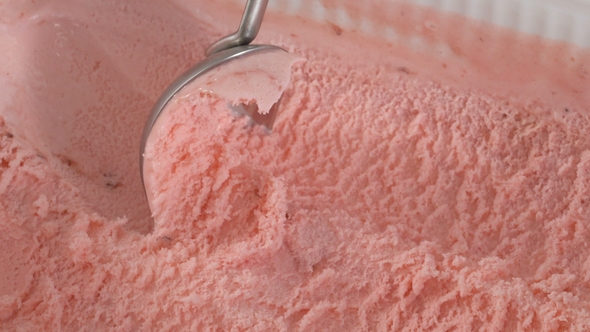 Strawberry Ice Cream Scooped Out of Container