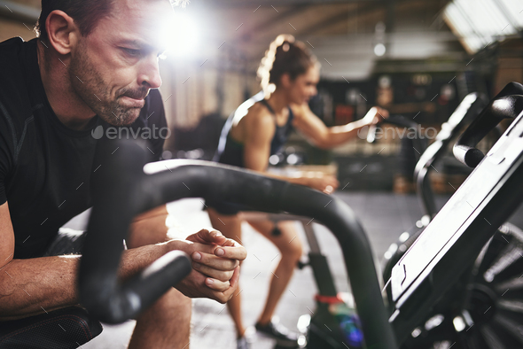 Male and woman taking rest after workout - Stock Photo - Images